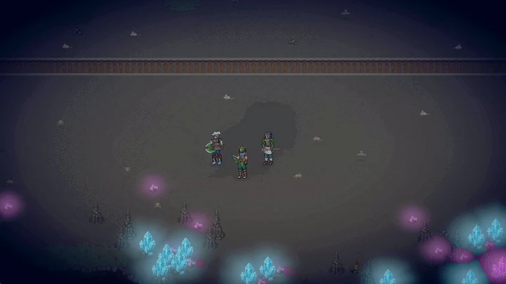 Three equipped adventurers exploring a blue-lit cavern together